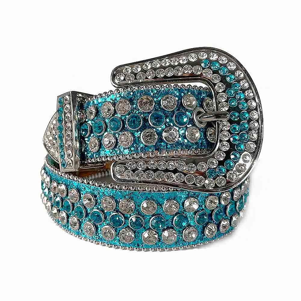 Unisex Turquoise Blue Leather Belt with Turquoise Blue Color Real Rhinestones & Classic Silver Buckle Add a touch of luxury and sparkle to your outfit with the Unisex Turquoise Blue Leather Belt from Real Rhinestone. Featuring a sleek Turquoise Blue leather strap, this stylish belt is adorned with Turquoise Blue and White Color diamond rhinestones, creating a bold and glamorous look. The Silver buckle, decorated with Turquoise Blue crystal rhinestones, enhances the design with extra shine and sophistication. Designed for versatility and comfort, this belt is perfect for both casual and dressy occasions. Whether you're looking to complete a hip-hop-inspired outfit, make a statement at an event, or simply add some extra bling to your wardrobe, this belt is the perfect accessory. Its adjustable fit ensures all-day comfort, while the high-quality materials guarantee durability and long-lasting wear. Elevate your style effortlessly with the Unisex Turquoise Blue Leather Belt. Whether you're hitting the stage, going out with friends, or just upgrading your everyday look, this belt is a must-have. Order now from Real Rhinestone and bring some diamond-studded brilliance to your collection. Material: Premium Leather Rhinestone: Luxury Hand-Set High-Gloss Crystal Diamond Embellishments Buckle Type: Classic Horseshoe Zinc Buckle Set Featuring Engraved Design & Sparkling Rhinestones Width: 4cm (1.5 Inch) Style: Streetwear, Cowboy, Western, Partywear, Festivals & Performances, Fashion, Hip Hop, Bling, Diamond Belt Measurement: Please note that measurements may vary by 1-2 cm. Our belts are measured from the fold where the buckle is attached to the middle hole. For the best fit, we recommend measuring a belt you already own from the fold to the hole you use most frequently. Ideally, the belt should be worn on the third hole for optimal fit and comfort.