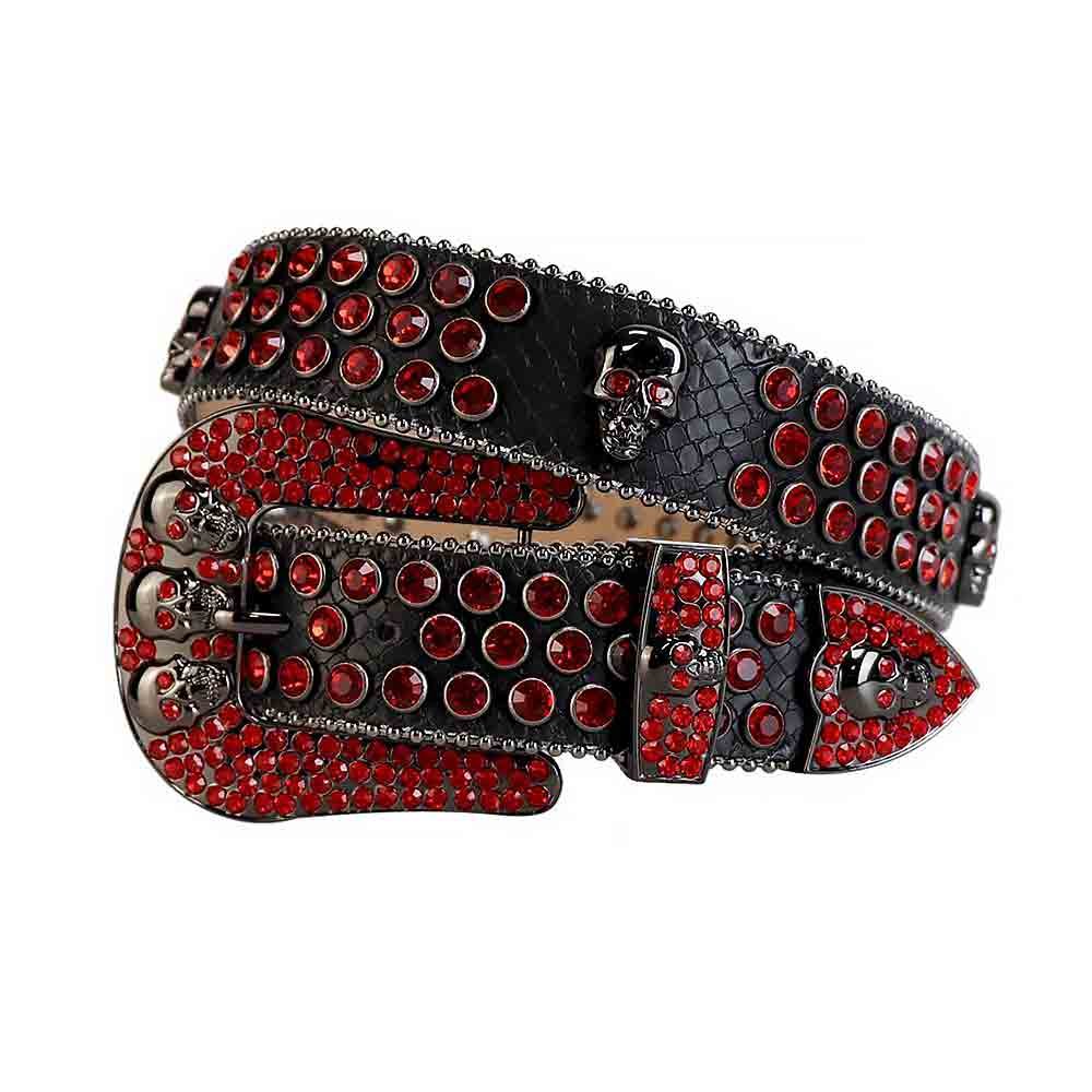 Unisex Black Leather Belt with Skulls Studded All Red Real Rhinestones & Classic Black Skull Buckle Add a touch of luxury and sparkle to your outfit with the Unisex Black Leather Belt from Real Rhinestone. Featuring a sleek Black leather strap, this stylish belt is adorned with Red Color diamond rhinestones, creating a bold and glamorous look. The Black buckle, decorated with Red crystal rhinestones, enhances the design with extra shine and sophistication. Designed for versatility and comfort, this belt is perfect for both casual and dressy occasions. Whether you're looking to complete a hip-hop-inspired outfit, make a statement at an event, or simply add some extra bling to your wardrobe, this belt is the perfect accessory. Its adjustable fit ensures all-day comfort, while the high-quality materials guarantee durability and long-lasting wear. Elevate your style effortlessly with the Unisex Black Leather Belt. Whether you're hitting the stage, going out with friends, or just upgrading your everyday look, this belt is a must-have. Order now from Real Rhinestone and bring some diamond-studded brilliance to your collection. Material: Premium Leather Rhinestone: Luxury Hand-Set High-Gloss Crystal Diamond Embellishments Buckle Type: Classic Horseshoe Zinc Buckle Set Featuring Engraved Design & Sparkling Rhinestones Width: 4cm (1.5 Inch) Style: Streetwear, Cowboy, Western, Partywear, Festivals & Performances, Fashion, Hip Hop, Bling, Diamond Belt Measurement: Please note that measurements may vary by 1-2 cm. Our belts are measured from the fold where the buckle is attached to the middle hole. For the best fit, we recommend measuring a belt you already own from the fold to the hole you use most frequently. Ideally, the belt should be worn on the third hole for optimal fit and comfort.