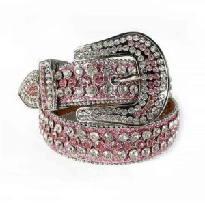 Unisex Pink Leather Belt with Silver And Pink Color Real Rhinestones & Classic Silver Buckle Add a touch of luxury and sparkle to your outfit with the Unisex Pink Leather Belt from Real Rhinestone. Featuring a sleek pink leather strap, this stylish belt is adorned with Pink Color and diamond white rhinestones, creating a bold and glamorous look. The Silver buckle, decorated with silver crystal rhinestones, enhances the design with extra shine and sophistication. Designed for versatility and comfort, this belt is perfect for both casual and dressy occasions. Whether you're looking to complete a hip-hop-inspired outfit, make a statement at an event, or simply add some extra bling to your wardrobe, this belt is the perfect accessory. Its adjustable fit ensures all-day comfort, while the high-quality materials guarantee durability and long-lasting wear. Elevate your style effortlessly with the Unisex Pink Leather Belt. Whether you're hitting the stage, going out with friends, or just upgrading your everyday look, this belt is a must-have. Order now from Real Rhinestone and bring some diamond-studded brilliance to your collection. Material: Premium Leather Rhinestone: Luxury Hand-Set High-Gloss Crystal Diamond Embellishments Buckle Type: Classic Horseshoe Zinc Buckle Set Featuring Engraved Design & Sparkling Rhinestones Width: 4cm (1.5 Inch) Style: Streetwear, Cowboy, Western, Partywear, Festivals & Performances, Fashion, Hip Hop, Bling, Diamond Belt Measurement: Please note that measurements may vary by 1-2 cm. Our belts are measured from the fold where the buckle is attached to the middle hole. For the best fit, we recommend measuring a belt you already own from the fold to the hole you use most frequently. Ideally, the belt should be worn on the third hole for optimal fit and comfort.