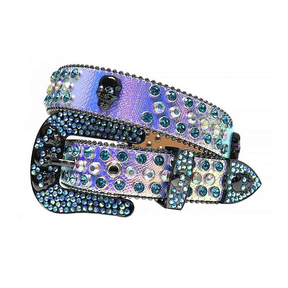 Unisex Purple Leather Belt with Skulls Studded Multi color Rhinestones & Classic Black Skull Buckle Add a touch of luxury and sparkle to your outfit with the Unisex Purple Leather Belt from Real Rhinestone. Featuring a sleek Purple leather strap, this stylish belt is adorned with Iridescent and Multi Color diamond rhinestones, creating a bold and glamorous look. The Black buckle, decorated with Iridescent and Multi color crystal rhinestones, enhances the design with extra shine and sophistication. Designed for versatility and comfort, this belt is perfect for both casual and dressy occasions. Whether you're looking to complete a hip-hop-inspired outfit, make a statement at an event, or simply add some extra bling to your wardrobe, this belt is the perfect accessory. Its adjustable fit ensures all-day comfort, while the high-quality materials guarantee durability and long-lasting wear. Elevate your style effortlessly with the Unisex Purple Leather Belt. Whether you're hitting the stage, going out with friends, or just upgrading your everyday look, this belt is a must-have. Order now from Real Rhinestone and bring some diamond-studded brilliance to your collection. Material: Premium Leather Rhinestone: Luxury Hand-Set High-Gloss Crystal Diamond Embellishments Buckle Type: Classic Horseshoe Zinc Buckle Set Featuring Engraved Design & Sparkling Rhinestones Width: 4cm (1.5 Inch) Style: Streetwear, Cowboy, Western, Partywear, Festivals & Performances, Fashion, Hip Hop, Bling, Diamond Belt Measurement: Please note that measurements may vary by 1-2 cm. Our belts are measured from the fold where the buckle is attached to the middle hole. For the best fit, we recommend measuring a belt you already own from the fold to the hole you use most frequently. Ideally, the belt should be worn on the third hole for optimal fit and comfort