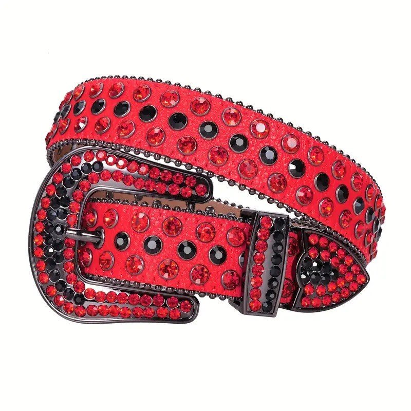 Unisex Red Glossy Leather Belt Adorned with Striking Red and Black Rhinestones for a Bold Statement Look Turn heads with the Rhinestone Belt with Engraved Cross Buckle Featuring Red And Black Studded Strap from Real Rhinestone — where craftsmanship meets bold style. This premium red leather strap is elevated with hand-set high-gloss crystal rhinestones with detailing, delivering a perfect blend of shine and attitude. The engraved cross buckle is the statement centerpiece, featuring intricate metalwork and sparkling rhinestone accents for a unique, high-impact finish. Designed for comfort and versatility, this belt pairs effortlessly with jeans, dresses, or stage outfits, making it a must-have for streetwear lovers, Western fashion fans, and anyone who wants to add a touch of bling. Key Features: Material: Premium Leather Rhinestones: Luxury Hand-Set High-Gloss Crystal Embellishments Buckle: Engraved horseshoe Zinc Alloy Buckle with Sparkling Rhinestones Width: 4cm (1.5 Inch) Style: Streetwear, Cowboy, Western, Partywear, Festivals, Fashion, Hip Hop, Bling, Diamond Belt Fit & Sizing: Measurements may vary by 1–2 cm. Belts are measured from the fold where the buckle is attached to the middle hole. For the best fit, measure a belt you already own from the fold to your most-used hole. Ideally worn on the third hole for comfort and style.