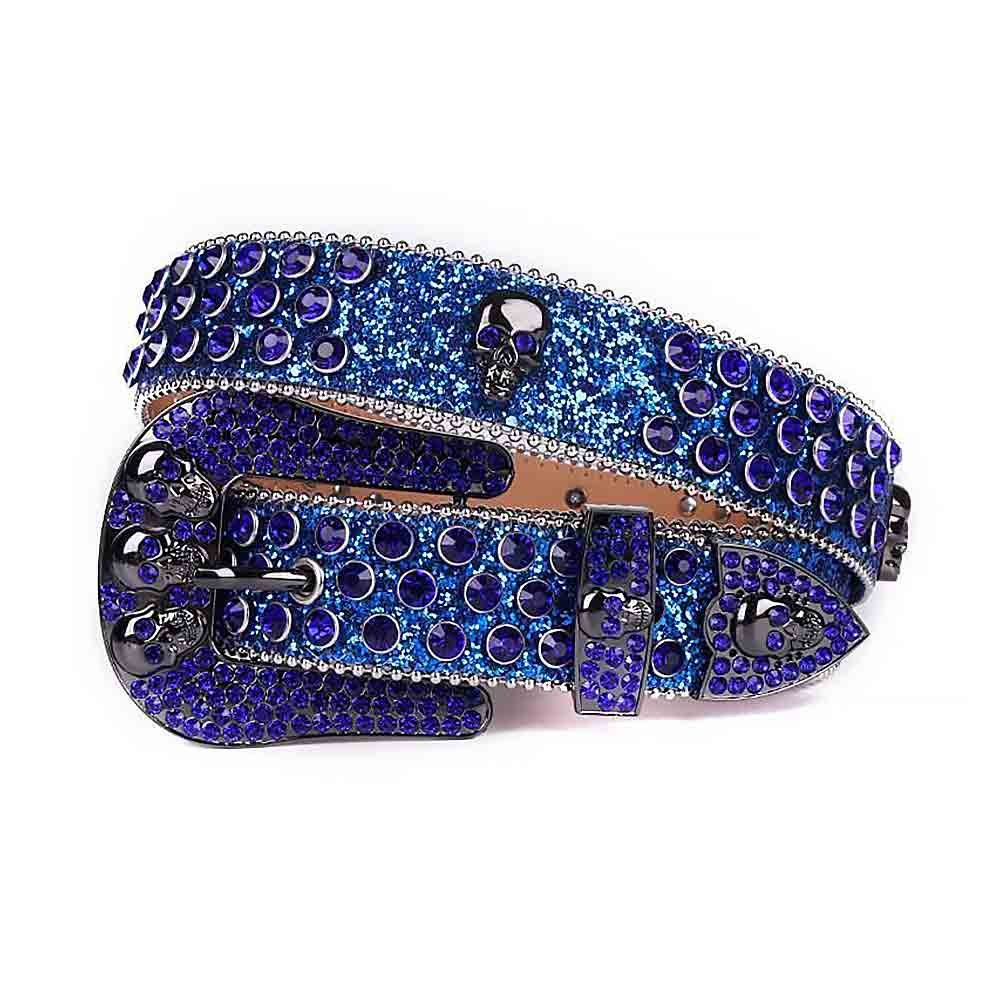 Unisex Royal Blue Leather Belt with Skulls Studded Blue Real Rhinestones & Classic Black Skull Buckle Add a touch of luxury and sparkle to your outfit with the Unisex Royal Blue Leather Belt from Real Rhinestone. Featuring a sleek Royal Blue leather strap, this stylish belt is adorned with Royal Blue Color diamond rhinestones, creating a bold and glamorous look. The Black buckle, decorated with Royal Blue crystal rhinestones, enhances the design with extra shine and sophistication. Designed for versatility and comfort, this belt is perfect for both casual and dressy occasions. Whether you're looking to complete a hip-hop-inspired outfit, make a statement at an event, or simply add some extra bling to your wardrobe, this belt is the perfect accessory. Its adjustable fit ensures all-day comfort, while the high-quality materials guarantee durability and long-lasting wear. Elevate your style effortlessly with the Unisex Royal Blue Leather Belt. Whether you're hitting the stage, going out with friends, or just upgrading your everyday look, this belt is a must-have. Order now from Real Rhinestone and bring some diamond-studded brilliance to your collection. Material: Premium Leather Rhinestone: Luxury Hand-Set High-Gloss Crystal Diamond Embellishments Buckle Type: Classic Horseshoe Zinc Buckle Set Featuring Engraved Design & Sparkling Rhinestones Width: 4cm (1.5 Inch) Style: Streetwear, Cowboy, Western, Partywear, Festivals & Performances, Fashion, Hip Hop, Bling, Diamond Belt Measurement: Please note that measurements may vary by 1-2 cm. Our belts are measured from the fold where the buckle is attached to the middle hole. For the best fit, we recommend measuring a belt you already own from the fold to the hole you use most frequently. Ideally, the belt should be worn on the third hole for optimal fit and comfort