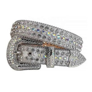 Unisex Silver Shimmer Leather Belt with Iridescent and Silver Real Rhinestones & Silver Buckle Add a touch of luxury and sparkle to your outfit with the Unisex Silver Shimmer Leather Belt from Real Rhinestone. Featuring a sleek Silver Shimmer leather strap, this stylish belt is adorned with Iridescent and Silver diamond rhinestones, creating a bold and glamorous look. The Silver buckle, decorated with Iridescent and Silver crystal rhinestones, enhances the design with extra shine and sophistication. Designed for versatility and comfort, this belt is perfect for both casual and dressy occasions. Whether you're looking to complete a hip-hop-inspired outfit, make a statement at an event, or simply add some extra bling to your wardrobe, this belt is the perfect accessory. Its adjustable fit ensures all-day comfort, while the high-quality materials guarantee durability and long-lasting wear. Elevate your style effortlessly with the Unisex Silver Shimmer Leather Belt. Whether you're hitting the stage, going out with friends, or just upgrading your everyday look, this belt is a must-have. Order now from Real Rhinestone and bring some diamond-studded brilliance to your collection. Material: Premium Leather Rhinestone: Luxury Hand-Set High-Gloss Crystal Diamond Embellishments Buckle Type: Classic Horseshoe Zinc Buckle Set Featuring Engraved Design & Sparkling Rhinestones Width: 4cm (1.5 Inch) Style: Streetwear, Cowboy, Western, Partywear, Festivals & Performances, Fashion, Hip Hop, Bling, Diamond Belt Measurement: Please note that measurements may vary by 1-2 cm. Our belts are measured from the fold where the buckle is attached to the middle hole. For the best fit, we recommend measuring a belt you already own from the fold to the hole you use most frequently. Ideally, the belt should be worn on the third hole for optimal fit and comfort.