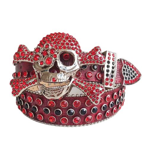 Unisex Red Leather Belt with Metal Studded Red & Black Rhinestones & Classic Gray Skull Buckle Add a touch of luxury and sparkle to your outfit with the Unisex Green Leather Belt from Real Rhinestone. Featuring a sleek Red leather strap, this stylish belt is adorned with Red And Black Color diamond rhinestones, creating a bold and glamorous look. The Gray buckle, decorated with red crystal rhinestones, enhances the design with extra shine and sophistication. Designed for versatility and comfort, this belt is perfect for both casual and dressy occasions. Whether you are looking to complete a hip-hop-inspired outfit, make a statement at an event, or simply add some extra bling to your wardrobe, this belt is the perfect accessory. Its adjustable fit ensures all-day comfort, while the high-quality materials guarantee durability and long-lasting wear. Elevate your style effortlessly with the Unisex Red Leather Belt. Whether you are hitting the stage, going out with friends, or just upgrading your everyday look, this belt is a must-have. Order now from Real Rhinestone and bring some diamond-studded brilliance to your collection. Material: Premium Leather Rhinestone: Luxury Hand-Set High-Gloss Crystal Diamond Embellishments Buckle Type: Classic Skull Zinc Buckle Set Featuring Engraved Design & Sparkling Rhinestones Width: 4cm (1.5 Inch) Style: Streetwear, Cowboy, Western, Partywear, Festivals & Performances, Fashion, Hip Hop, Bling, Diamond Belt Measurement: Please note that measurements may vary by 1-2 cm. Our belts are measured from the fold where the buckle is attached to the middle hole. For the best fit, we recommend measuring a belt you already own from the fold to the hole you use most frequently. Ideally, the belt should be worn on the third hole for optimal fit and comfort.