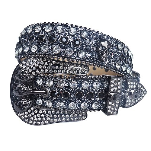 Unisex black shimmer leather belt, with studded skulls and white rhinestones decorated in a distinctive pattern. Add a touch of luxury and sparkle to your outfit with the Unisex Black Leather Belt from Real Rhinestone. Featuring a black leather strap, this stylish belt is adorned with white and black Color diamond rhinestones, creating a bold and glamorous look. The Gray buckle, decorated with white crystal rhinestones, enhances the design with extra shine and sophistication. Designed for versatility and comfort, this belt is perfect for both casual and dressy occasions. Whether you are looking to complete a hip-hop-inspired outfit, make a statement at an event, or simply add some extra bling to your wardrobe, this belt is the perfect accessory. Its adjustable fit ensures all-day comfort, while the high-quality materials guarantee durability and long-lasting wear. Elevate your style effortlessly with the Unisex Black Leather Belt. Whether you are hitting the stage, going out with friends, or just upgrading your everyday look, this belt is a must-have. Order now from Real Rhinestone and bring some diamond-studded brilliance to your collection. Material: Premium Leather Rhinestone: Luxury Hand-Set High-Gloss Crystal Diamond Embellishments Buckle Type: Classic horseshoe Zinc Buckle Set Featuring Engraved Design & Sparkling Rhinestones Width: 4cm (1.5 Inch) Style: Streetwear, Cowboy, Western, Partywear, Festivals & Performances, Fashion, Hip Hop, Bling, Diamond Belt Measurement: Please note that measurements may vary by 1-2 cm. Our belts are measured from the fold where the buckle is attached to the middle hole. For the best fit, we recommend measuring a belt you already own from the fold to the hole you use most frequently. Ideally, the belt should be worn on the third hole for optimal fit and comfort.
