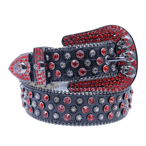 Unisex black shimmer leather belt, with starburst studs, skulls and red rhinestones decorated in a bold western-inspired pattern. Add a touch of luxury and sparkle to your outfit with the Unisex Black Leather Belt from Real Rhinestone. Featuring a black leather strap, this stylish belt is adorned with red Color diamond rhinestones, creating a bold and glamorous look. The Gray buckle, decorated with red crystal rhinestones, enhances the design with extra shine and sophistication. Designed for versatility and comfort, this belt is perfect for both casual and dressy occasions. Whether you are looking to complete a hip-hop-inspired outfit, make a statement at an event, or simply add some extra bling to your wardrobe, this belt is the perfect accessory. Its adjustable fit ensures all-day comfort, while the high-quality materials guarantee durability and long-lasting wear. Elevate your style effortlessly with the Unisex Black Leather Belt. Whether you are hitting the stage, going out with friends, or just upgrading your everyday look, this belt is a must-have. Order now from Real Rhinestone and bring some diamond-studded brilliance to your collection. Material: Premium Leather Rhinestone: Luxury Hand-Set High-Gloss Crystal Diamond Embellishments Buckle Type: Classic horseshoe Zinc Buckle Set Featuring Engraved Design & Sparkling Rhinestones Width: 4cm (1.5 Inch) Style: Streetwear, Cowboy, Western, Partywear, Festivals & Performances, Fashion, Hip Hop, Bling, Diamond Belt Measurement: Please note that measurements may vary by 1-2 cm. Our belts are measured from the fold where the buckle is attached to the middle hole. For the best fit, we recommend measuring a belt you already own from the fold to the hole you use most frequently. Ideally, the belt should be worn on the third hole for optimal fit and comfort.