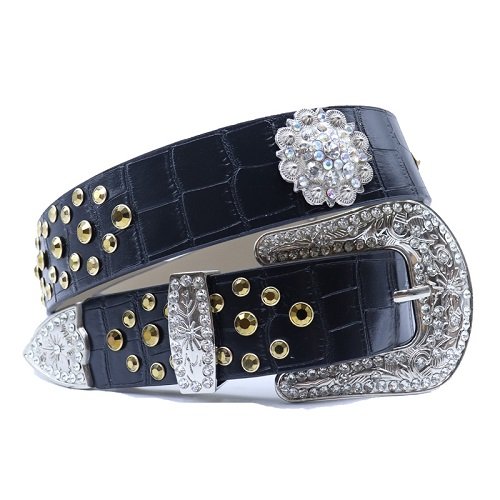Unisex black croc leather belt, with gold rhinestones decorated with star shaped concho Add a touch of luxury and sparkle to your outfit with the Unisex Black Leather Belt from Real Rhinestone. Featuring a black leather strap, this stylish belt is adorned with gold Color diamond rhinestones, creating a bold and glamorous look. The silver buckle, decorated with floral design, enhances the design with extra shine and sophistication. Designed for versatility and comfort, this belt is perfect for both casual and dressy occasions. Whether you are looking to complete a hip-hop-inspired outfit, make a statement at an event, or simply add some extra bling to your wardrobe, this belt is the perfect accessory. Its adjustable fit ensures all-day comfort, while the high-quality materials guarantee durability and long-lasting wear. Elevate your style effortlessly with the Unisex Black Leather Belt. Whether you are hitting the stage, going out with friends, or just upgrading your everyday look, this belt is a must-have. Order now from Real Rhinestone and bring some diamond-studded brilliance to your collection. Material: Premium Leather Rhinestone: Luxury Hand-Set High-Gloss Crystal Diamond Embellishments Buckle Type: Classic horseshoe Zinc Buckle Set Featuring Engraved Design & Sparkling Rhinestones Width: 4cm (1.5 Inch) Style: Streetwear, Cowboy, Western, Partywear, Festivals & Performances, Fashion, Hip Hop, Bling, Diamond Belt Measurement: Please note that measurements may vary by 1-2 cm. Our belts are measured from the fold where the buckle is attached to the middle hole. For the best fit, we recommend measuring a belt you already own from the fold to the hole you use most frequently. Ideally, the belt should be worn on the third hole for optimal fit and comfort.