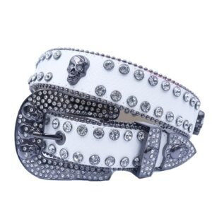 Unisex white leather belt, with studded skulls and white rhinestones decorated in a distinctive pattern. Add a touch of luxury and sparkle to your outfit with the Unisex White Leather Belt from Real Rhinestone. Featuring a white leather strap, this stylish belt is adorned with white Color diamond rhinestones, creating a bold and glamorous look. The Gray buckle, decorated with white crystal rhinestones, enhances the design with extra shine and sophistication. Designed for versatility and comfort, this belt is perfect for both casual and dressy occasions. Whether you are looking to complete a hip-hop-inspired outfit, make a statement at an event, or simply add some extra bling to your wardrobe, this belt is the perfect accessory. Its adjustable fit ensures all-day comfort, while the high-quality materials guarantee durability and long-lasting wear. Elevate your style effortlessly with the Unisex White Leather Belt. Whether you are hitting the stage, going out with friends, or just upgrading your everyday look, this belt is a must-have. Order now from Real Rhinestone and bring some diamond-studded brilliance to your collection. Material: Premium Leather Rhinestone: Luxury Hand-Set High-Gloss Crystal Diamond Embellishments Buckle Type: Classic horseshoe Zinc Buckle Set Featuring Engraved Design & Sparkling Rhinestones Width: 4cm (1.5 Inch) Style: Streetwear, Cowboy, Western, Partywear, Festivals & Performances, Fashion, Hip Hop, Bling, Diamond Belt Measurement: Please note that measurements may vary by 1-2 cm. Our belts are measured from the fold where the buckle is attached to the middle hole. For the best fit, we recommend measuring a belt you already own from the fold to the hole you use most frequently. Ideally, the belt should be worn on the third hole for optimal fit and comfort.