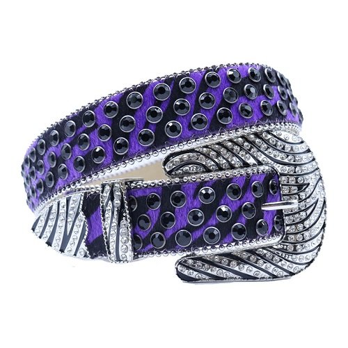 Unisex purple and black leather belt, with studded black and silver rhinestones in a distinctive horseshoe pattern. Add a touch of luxury and sparkle to your outfit with the Unisex Purple and Black Leather Belt from Real Rhinestone. Featuring a purple and black leather strap, this stylish belt is adorned with black Color diamond rhinestones, creating a bold and glamorous look. The Silver buckle, decorated with silver crystal rhinestones, enhances the design with extra shine and sophistication. Designed for versatility and comfort, this belt is perfect for both casual and dressy occasions. Whether you are looking to complete a hip-hop-inspired outfit, make a statement at an event, or simply add some extra bling to your wardrobe, this belt is the perfect accessory. Its adjustable fit ensures all-day comfort, while the high-quality materials guarantee durability and long-lasting wear. Elevate your style effortlessly with the Unisex Purple and Black Leather Belt. Whether you are hitting the stage, going out with friends, or just upgrading your everyday look, this belt is a must-have. Order now from Real Rhinestone and bring some diamond-studded brilliance to your collection. Material: Premium Leather Rhinestone: Luxury Hand-Set High-Gloss Crystal Diamond Embellishments Buckle Type: Classic horseshoe Zinc Buckle Set Featuring Engraved Design & Sparkling Rhinestones Width: 4cm (1.5 Inch) Style: Streetwear, Cowboy, Western, Partywear, Festivals & Performances, Fashion, Hip Hop, Bling, Diamond Belt Measurement: Please note that measurements may vary by 1-2 cm. Our belts are measured from the fold where the buckle is attached to the middle hole. For the best fit, we recommend measuring a belt you already own from the fold to the hole you use most frequently. Ideally, the belt should be worn on the third hole for optimal fit and comfort.