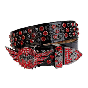 Unisex Black Embossed Leather Belt Embellished With Red And Black Rhinestones And Polished Gold wing Buckle Add a touch of luxury and sparkle to your outfit with the Unisex Black Leather Belt from Real Rhinestone. Featuring a sleek black leather strap, this stylish belt is adorned with Red And black Color diamond rhinestones, creating a bold and glamorous look. The Gold buckle, decorated with rhinestones, enhances the design with extra shine and sophistication. Designed for versatility and comfort, this belt is perfect for both casual and dressy occasions. Whether you are looking to complete a hip-hop-inspired outfit, make a statement at an event, or simply add some extra bling to your wardrobe, this belt is the perfect accessory. Its adjustable fit ensures all-day comfort, while the high-quality materials guarantee durability and long-lasting wear. Elevate your style effortlessly with the Unisex Black Leather Belt. Whether you are hitting the stage, going out with friends, or just upgrading your everyday look, this belt is a must-have. Order now from Real Rhinestone and bring some diamond-studded brilliance to your collection. Material: Premium Leather Rhinestone: Luxury Hand-Set High-Gloss Crystal Diamond Embellishments Buckle Type: Classic wing Zinc Buckle Set Featuring Engraved Design & Sparkling Rhinestones Width: 4cm (1.5 Inch) Style: Streetwear, Cowboy, Western, Partywear, Festivals & Performances, Fashion, Hip Hop, Bling, Diamond Belt Measurement: Please note that measurements may vary by 1-2 cm. Our belts are measured from the fold where the buckle is attached to the middle hole. For the best fit, we recommend measuring a belt you already own from the fold to the hole you use most frequently. Ideally, the belt should be worn on the third hole for optimal fit and comfort.