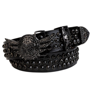 Unisex Black Leather Belt Accented With Black Rhinestones And Polished Black wing Buckle Add a touch of luxury and sparkle to your outfit with the Unisex Black Leather Belt from Real Rhinestone. Featuring a sleek black leather strap, this stylish belt is adorned with black Color diamond rhinestones, creating a bold and glamorous look. The Black buckle, decorated with rhinestones, enhances the design with extra shine and sophistication. Designed for versatility and comfort, this belt is perfect for both casual and dressy occasions. Whether you are looking to complete a hip-hop-inspired outfit, make a statement at an event, or simply add some extra bling to your wardrobe, this belt is the perfect accessory. Its adjustable fit ensures all-day comfort, while the high-quality materials guarantee durability and long-lasting wear. Elevate your style effortlessly with the Unisex Black Leather Belt. Whether you are hitting the stage, going out with friends, or just upgrading your everyday look, this belt is a must-have. Order now from Real Rhinestone and bring some diamond-studded brilliance to your collection. Material: Premium Leather Rhinestone: Luxury Hand-Set High-Gloss Crystal Diamond Embellishments Buckle Type: Classic wing Zinc Buckle Set Featuring Engraved Design & Sparkling Rhinestones Width: 4cm (1.5 Inch) Style: Streetwear, Cowboy, Western, Partywear, Festivals & Performances, Fashion, Hip Hop, Bling, Diamond Belt Measurement: Please note that measurements may vary by 1-2 cm. Our belts are measured from the fold where the buckle is attached to the middle hole. For the best fit, we recommend measuring a belt you already own from the fold to the hole you use most frequently. Ideally, the belt should be worn on the third hole for optimal fit and comfort.