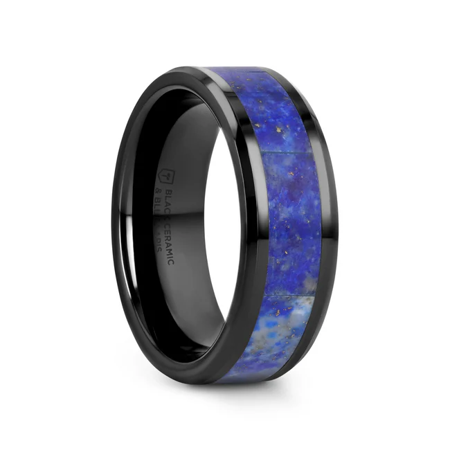 MARLOW Men’s Polished Black Ceramic Wedding Band with Blue Lapis Inlay and Beveled Edges - 8mm Inlaid with sparkling and striking Genuine Blue Lapis Lazuli, one of the most desired stones in the world and a symbol of protection, honor, wisdom and truth is this amazing Black Ceramic men’s wedding band by Thorsten. Engraving available! See Pictures for Details. Does Not Delay Order. Includes Thorsten Lifetime and Lifetime Sizing Warranty (excluding re-engraving). Black Ceramic will not scratch and does not lose its color. Note, the Lapis lazuli inlay can be scratched. Available in an 8mm width. Comfort Fit – domed interior band slides over the knuckle easier with less friction. Brand: Thorsten Metal Type: Ceramic Color: Black|Blue Finish: Polished Style: Lapis Inlay Stones: None SKU: C5731-PBCL