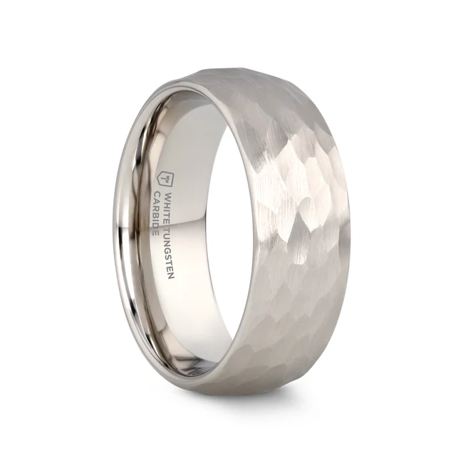 CHANDLER Domed Hammered Finish White Tungsten Ring - 6mm or 8mm This beautiful White Tungsten Carbide wedding band design by Thorsten features a domed profile with a beautiful hammered finish all over its surface and can be worn as a wedding band or promise ring. Engraving available! See Pictures for Details. Does Not Delay Order. Includes Thorsten Lifetime and Lifetime Sizing Warranty (excluding re-engraving). Available in 6mm and 8mm widths for couples who want a matching set. Tungsten Carbide is the newest and strongest metal for jewelry that does not scratch easily. Comfort Fit – domed interior band slides over the knuckle easier with less friction. Brand: Thorsten Metal Type: White Tungsten Color: Silver Finish: Hammered Style: Domed Stones: None SKU: C636-DHF