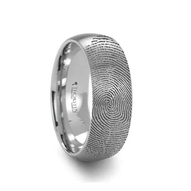 Fingerprint Ring Engraved Domed Tungsten Ring Brushed Ring - 4mm - 12mm Customize this precision crafted ring from our line of Comfort Fit Tungsten Carbide Rings with a fingerprint of you, or your loved one. Fingerprints can be engraved on the inside or outside of this band, all fingerprints are engraved on the outside of the band unless specifically stated in your order notes. This ring has a nice brushed finish that provides as very nice detailed look. This ring style is available in 4mm, 6mm, 8mm, 10mm, and 12mm. It can be worn as a Wedding Ring or Promise Ring by men or women. Brand: Thorsten Metal Type: Tungsten Carbide Color: Silver Finish: Brushed Style: Domed|Engraved Stones: None SKU: F1299-FBBT