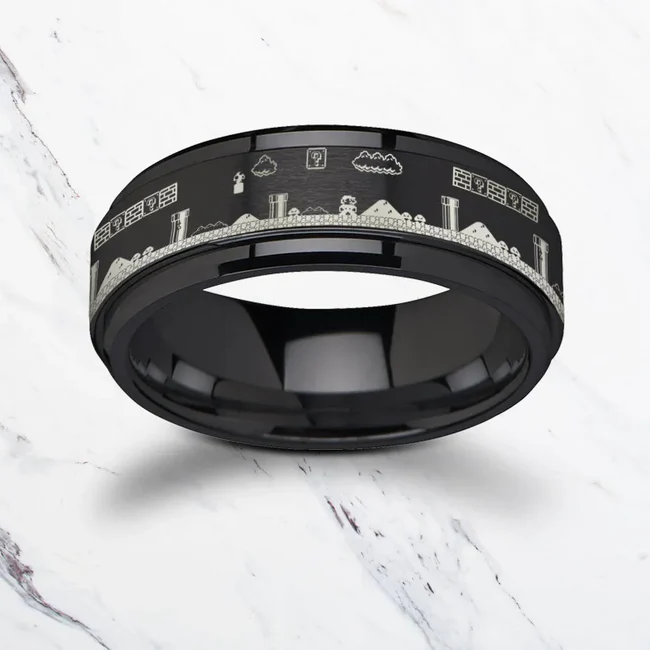 Spinning Engraved Super Mario Bros Pixel Level Game Black Tungsten Carbide Spinner Wedding Band - 8mm Skillfully inlaid in the center of this Tungsten Carbide ring by Thorsten is a beautiful, intricate engraving design. Perfect for enthusiasts and special occasions alike! Engraving available! See Pictures for Details. Does Not Delay Order Includes Thorsten Lifetime and Lifetime Sizing Warranty (excluding re-engraving). Tungsten Carbide—the newest and strongest metal for jewelry that does not scratch easily. Comfort Fit – domed interior band slides over the knuckle easier with less friction Brand: ThorstenMetal Type: Black Tungsten Color: BlackFinish: Polished tyle: Engraved|Flat|Raised Center Stones: None SKU: F1567-TCSR
