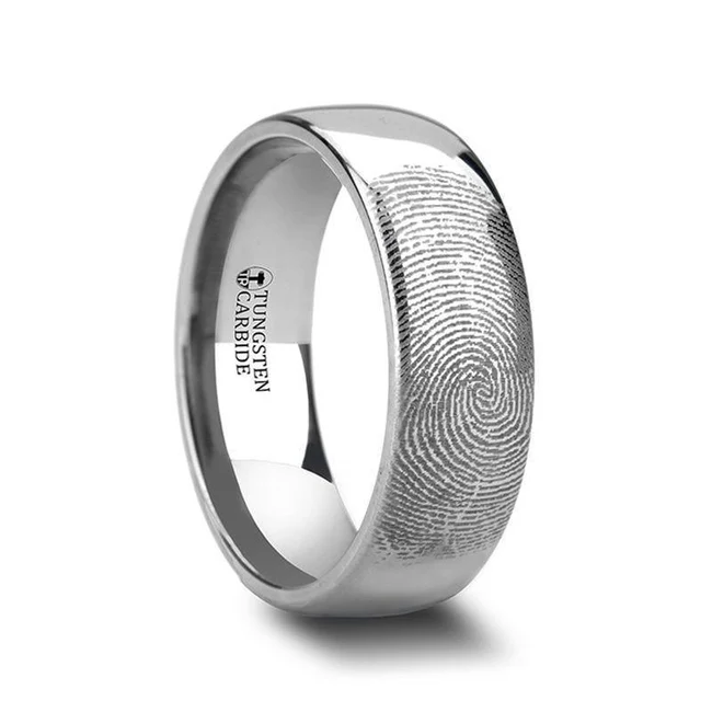 Customize this precision crafted Tungsten Carbide ring by Thorsten with a fingerprint from you, or from your loved one. Fingerprints can be engraved on the inside or outside of this band (all fingerprints are engraved on the outside of the band unless specifically stated in your order notes).  Engraving available! See Pictures for Details. Does Not Delay Order. Available in 4mm, 6mm, 8mm, 10mm, and 12mm widths for couples who want a matching set. Tungsten Carbide—the newest and strongest metal for jewelry that does not scratch easily. Comfort Fit – domed interior band slides over the knuckle easier with less friction. Brand: Thorsten Metal Type: Tungsten Carbide Color: Silver Finish: Polished Style: Domed|Engraved Stones: None SKU: F860-DPTC