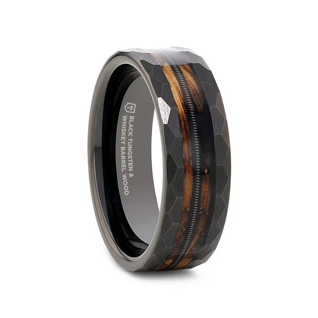 RIFF Black Tungsten Ring, features a unique blend of a charred whiskey barrel and guitar string for a edgy look. Superior craftsmanship and timeless elegance. Made from whiskey barrels once used by Jack Daniel's Distillery. A flat shape denotes pieces with minimal 3D depth, showcasing smooth surfaces that often display decorative designs or engravings. Black tungsten jewelry offers a striking and contemporary aesthetic. The black finish is achieved through a PVD (Physical Vapor Deposition) process, which provides a sleek, dark appearance while maintaining the inherent durability and scratch resistance of tungsten. Polished finish enhances the overall aesthetic of the piece, giving it a lustrous and elegant finish, making it a popular choice for those who appreciate a sleek and refined look. Brand: Thorsten Metal Type: Black Tungsten Color: Black|Brown Finish: Polished Style: Flat Stones: None SKU: R0723-BPBT