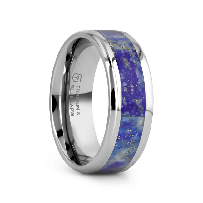MALONE Men's Titanium Wedding Ring with Lapis Lazuli Inlay and Beveled Edges - 8mm Solidify your commitment with a wedding band that captivates the eye. Created in titanium, this men’s wedding band is inlaid with striking Genuine Blue Lapis Lazuli. Lapis lazuli has been one of the most desired stones since it was acquired from some of the oldest mines in the world hundreds of years ago. This gorgeous blue gem is not only visually attractive, but it is also symbolic of protection, honor, wisdom and truth. Both beveled edges are polished to a brilliant shine. This flat profile ring is available in an 8mm width. Re-sizing and Warranty on all Titanium rings, limited exchange|sizing fees compared to our competitors. Brand: Thorsten Metal Type: Titanium Color: Blue|Silver Finish: Polished Style: Lapis Inlay Stones: None SKU: T1585-BLBE