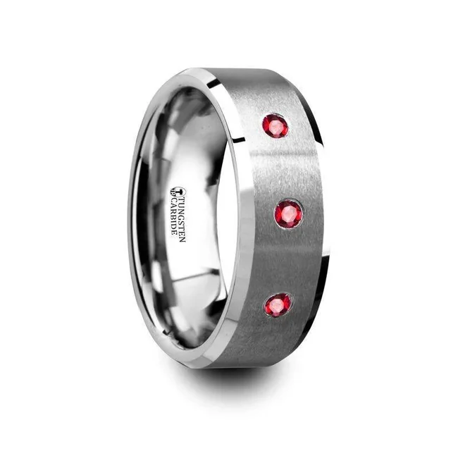 NEREUS Brushed Tungsten Flat Wedding Band with Polished Beveled Edges and Rubies - 8mm Three rubies are the center focal point of this contemporary men’s wedding band. Fashioned in tungsten carbide, this ring features a brushed finish across the center and polished beveled edges for added shine. It’s also made with a rounded comfort fit interior for ultimate wearability. This ring is available in an 8mm width. You can find similar ring styles in our brushed, satin and matte finish wedding bands collection. This ring is covered by a lifetime Thorsten warranty that covers scratching, breakage and manufacturing defects. While supplies last. Brand: Thorsten Metal Type: Tungsten Carbide Color: Red|Silver Finish: Brushed Style: Gemstones Stones: Ruby SKU: T5415-BPTR