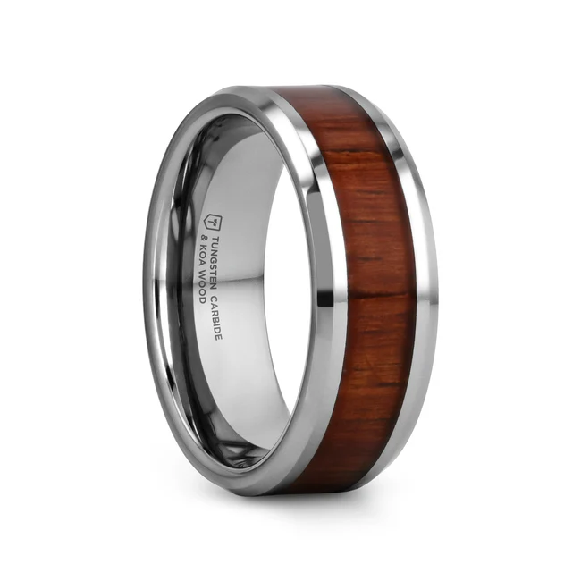 KONA Hawaiian Koa Wood Tungsten Ring with Bevels and Koa Wood Inlay - 10mm This highly sought after koa wood inlay tungsten ring comes from our wood inlay rings line is made of ultra hard tungsten and rare exotic koa wood. This design brings together the most scratch resistant material and one of the rarest woods on earth; Hawaiian koa wood. The inlay is made of 100% authentic Hawaiian koa wood, which cannot be cut down under Hawaiian law. Only trees that have fallen on their own can be harvested, which makes koa wood one of the most expensive woods in the world. This comfort-fit band has beveled edges and comes available in a 10 mm width. This is the perfect wedding band to represent your love and commitment. Note, inlay is protected by a resin that can be scratched. Re-sizing and Warranty on all Thorsten alternative metal rings, no exchange|sizing fees. Brand: Thorsten Metal Type: Tungsten Carbide Color: Brown|Silver Finish: Polished Style: Beveled|Wood Inlay Stones: None SKU: W1891-KOWI