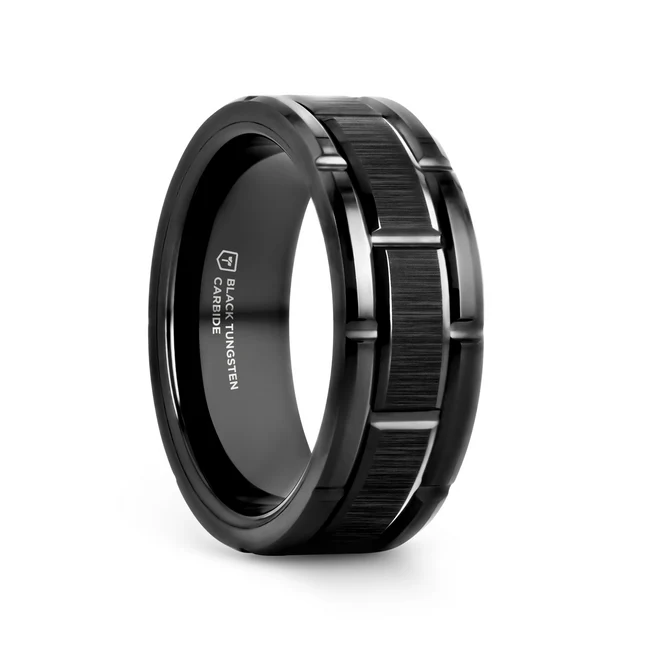This remarkable, attention-grabbing Black Tungsten Carbide ring design from Thorsten features a beautiful vertically-brushed finish on the center band flanked with carved side band segments with polished beveled edges and can be worn as a wedding band or promise ring. Engraving available! See Pictures for Details. Does Not Delay Order Includes Thorsten Lifetime and Lifetime Sizing Warranty (excluding re-engraving) Please note, Black Tungsten Carbide rings are scratch-resistant and very durable but can be scratched Available in 8mm and 10mm widths for couples who want a matching set Comfort Fit – domed interior band slides over the knuckle easier with less friction Brand: Thorsten Metal Type: Black Tungsten Color: Black Finish: Brushed Style: Beveled|Grooved|Raised Center Stones: None SKU: W1971-WBST