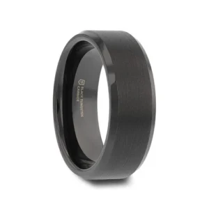 Made from high grade Black Tungsten Carbide this durable, simple yet elegant Thorsten design features a flat-profiled band with a finely brushed finish and polished beveled edges with a subtle touch of shine.  Includes Thorsten Lifetime and Lifetime Sizing Warranty (excluding re-engraving) Available in 4mm, 6mm, 7mm, 8mm, and 10mm widths for couples who want a matching set Please note, Black Tungsten Carbide rings are scratch-resistant and very durable but can be scratched Comfort Fit – domed interior band slides over the knuckle easier with less friction Brand: Thorsten Metal Type: Black Tungsten Color: Black Finish: Brushed Style: Beveled|Flat Stones: None SKU: W2048-FBBE
