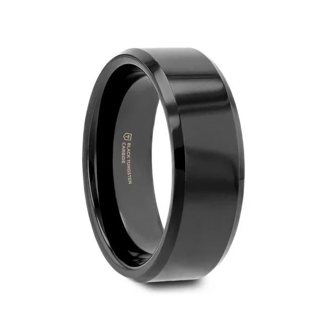 The bold and polished finish of this Black Tungsten ring by Thorsten has beveled edges giving it a subtle classic character.  Engraving available! See Pictures for Details. Does Not Delay Order. Includes Thorsten Lifetime and Lifetime Sizing Warranty (excluding re-engraving). Please note, Black Tungsten Carbide rings are scratch-resistant and very durable but can be scratched. Available in 4mm, 6mm, 7mm, 8mm, 10mm, and 12mm widths for couples who want a matching set. Comfort Fit – domed interior band slides over the knuckle easier with less friction. Brand: ThorstenMetal Type: Black Tungsten Color: Black Finish: BrushedStyle: Beveled|Flat Stones: None SKU: W270-BBT