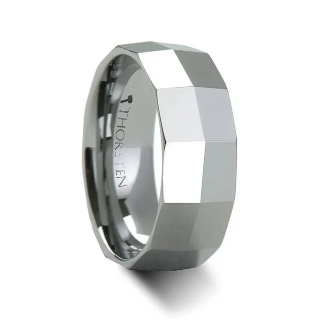 CALGARY 8mm Rectangular Faceted Knife Edge Tungsten Carbide Ring - 8mm This beautiful polished finish tungsten carbide wedding band from our collection has been precision-machined to have sloping edges that gradually rise and meet in the center of the ring to form a "knife edge" look. The raw strength of tungsten carbide on these wedding bands is unmatched by any other material. Available in a 8mm width This is the perfect wedding band for a woman to represent the strength of her love. Re-sizing and Warranty on all Thorsten alternative metal rings, limited exchange|sizing fees compared to other retailers. While supplies last. Brand: Thorsten Metal Type: Tungsten Carbide Color: Silver Finish: Polished Style: Domed|Flat Stones: None SKU: W280-RFKE
