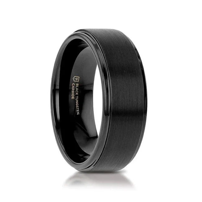 ORION Flat Black Tungsten Ring with Brushed Raised Center and Polished Step Edges - 6mm - 8mm Minimally designed yet jaw dropping. This flat pipe-cut shape black Tungsten Carbide ring by Thorsten features a brush finished raised center with polished step edges. Engraving available! See Pictures for Details. Does Not Delay Order. Includes Thorsten Lifetime and Lifetime Sizing Warranty (excluding re-engraving). Please note, Black Tungsten Carbide rings are scratch-resistant and very durable but can be scratched. Available in 6mm and 8mm widths for couples who want a matching set. Comfort Fit – domed interior band slides over the knuckle easier with less friction. Brand: Thorsten Metal Type: Black Tungsten Color: Black Finish: Brushed Style: Flat|Raised Center Stones: None SKU: W2962-BTRP