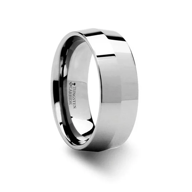 SHOGUN Knife Edge Tungsten Wedding Band - 4mm and 8mm An homage to the master samurai sword makers of Japan, this simple but sharp knife edge Thorsten wedding band design features two wide bevels on either edge that create a smooth and polished knife-like edge in the center of the ring. Engraving available! See Pictures for Details. Does Not Delay Order. Includes Thorsten Lifetime and Lifetime Sizing Warranty (excluding re-engraving). Available in 4mm and 8mm widths for couples who want a matching set. Tungsten Carbide is the newest and strongest metal for jewelry that does not scratch easily. Comfort Fit – domed interior band slides over the knuckle easier with less friction. Brand: Thorsten Metal Type: Tungsten CarbideColor: Silver Finish: Polished Style: Flat Stones: None SKU: W321-KEC