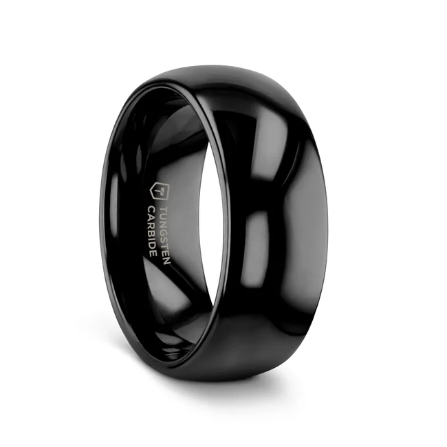 The classic domed style Black Tungsten Carbide wedding band by Thorsten has a smooth deep black onyx like finish giving it a beautiful lustrous dark sheen and can be worn as a wedding band or promise ring. Engraving available! See Pictures for Details. Does Not Delay Order Available in 2mm, 4mm, 6mm, 7mm, 8mm, 10mm, and 12mm widths for couples who want a matching set Please note, Black Tungsten Carbide rings are scratch resistant and very durable but can be scratched Comfort Fit – domed interior band slides over the knuckle easier with less friction Brand: Thorsten Metal Type: Black Tungsten Color: Black Finish: Polished Style: Domed Stones: None SKU: W336-DPBT