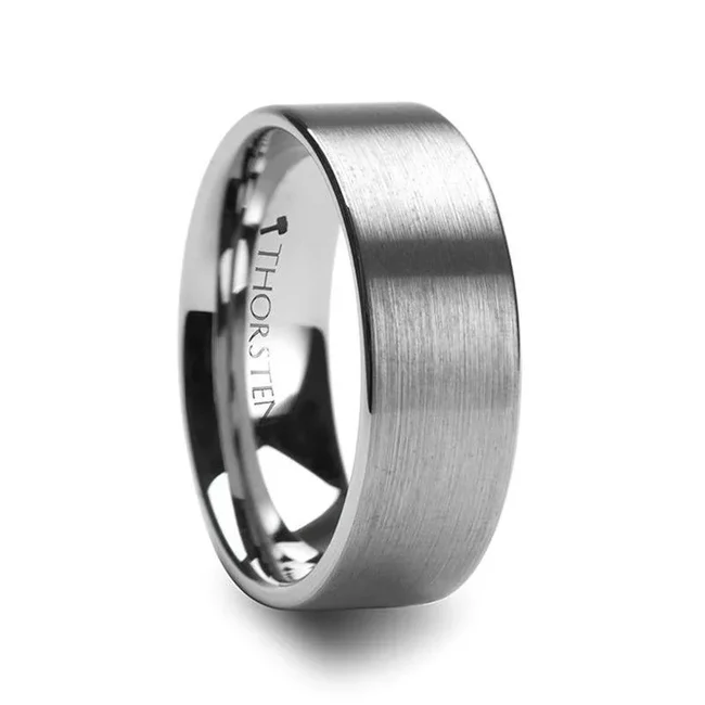 This elegant yet simple Tungsten Carbide wedding band design by Thorsten features a fine brush finish resulting in a less reflective finish than a polished ring which many more conservative couples prefer.  Includes Thorsten Lifetime and Lifetime Sizing Warranty (excluding re-engraving). Tungsten Carbide is the newest and strongest metal for jewelry that does not scratch easily. Comfort Fit – domed interior band slides over the knuckle easier with less friction. Brand: Thorsten Metal Type: Tungsten Carbide Color: Silver Finish: Brushed Style: Flat Stones: None SKU: W342-FBF