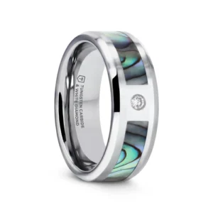 This beautiful Tungsten Carbide ring by Thorsten features a Mother-of-Pearl inlay displaying iridescent purple, blue, green, white, and black swirls like the shimmering waves in the ocean. Made from the inside lining of oyster and abalone shells, Mother-of-Pearl is a decorative material that has been used for centuries for furniture, musical instruments, and jewelry. If that weren’t enough, this beautiful ring also features a classic 0.06 carat round cut white diamond with a color I and clarity of I1. Engraving available! See Pictures for Details. Does Not Delay Order. Includes Thorsten Lifetime and Lifetime Sizing Warranty (excluding re-engraving). Available in an 8mm width. Tungsten Carbide—the newest and strongest metal for jewelry that does not scratch easily. Note that the Mother-of-Pearl inlay may chip if the ring is dropped on a hard surface. Comfort Fit – domed interior band slides over the knuckle easier with less friction. Brand: Thorsten Metal Type: Tungsten Carbide Color: Blue|Green|Silver Finish: Polished Style: Beveled|Diamonds|Flat|Mother of Pearl Inlay Stones: None SKU: W4276-MOPI