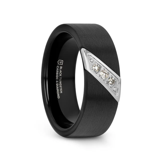 This is a black tungsten carbide wedding band that is simply a classic and timeless style that will never become dull. This black tungsten ring is created with three white diamonds with a total weight of 0.12 carats set diagonally across the width of the ring. The 3 slanted white diamonds combines perfectly in a slanted steel frame in the black tungsten ring. This comfort-fit band is flat in design and comes in an 8 mm width. This is the perfect wedding band to represent your love and commitment. Note, inlay is protected by a resin that can be scratched. Re-sizing and Warranty on all tungsten rings. Brand: Thorsten Metal Type: Black Tungsten Color: Black|Silver Finish: Matte-Satin Style: Diamonds|Flat Stones: None SKU: W4284-BTSD