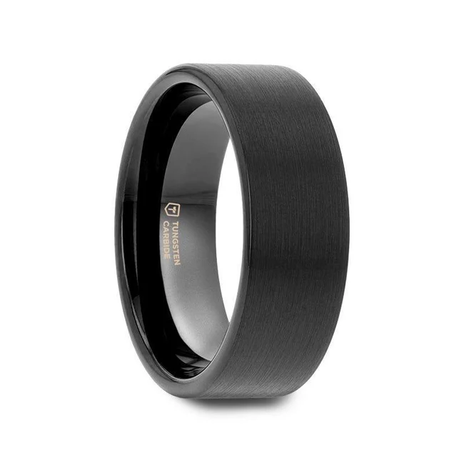 This appealing Black Tungsten Carbide wedding band by Thorsten has a precision crafted, brushed finish for those who prefer to make a more understated yet elegant statement and can be worn as a wedding band or as a promise ring by men or women. Engraving available! See Pictures for Details. Does Not Delay Order Please note, Black Tungsten Carbide rings are scratch resistant and very durable but can be scratched Available in 4mm, 6mm, 7mm, 8mm, 10mm, and 12mm widths for couples who want a matching set Comfort Fit – domed interior band slides over the knuckle easier with less friction Brand: Thorsten Metal Type: Black Tungsten Color: Black Finish: Brushed Style: Flat Stones: None SKU: W589-FBBT