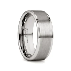 This precision crafted flat style white tungsten ring with brush finished center from our White Tungsten Rings line is made especially for couples who love the durability of tungsten and the bright white color of platinum. This style is available in 4mm, 6mm and 8mm wide for couples who prefer matching rings.  White tungsten is made by embedding rhodium, a platinum group metal, into the surface of a tungsten ring. The color is very similar to platinum or white gold, which is whiter in color than normal tungsten. This unique bonding process makes the plating more scratch resistant than white gold wedding bands and does not need to be replated frequently. This is the perfect wedding band because it combines the best of both worlds. Brand: Thorsten Metal Type: White Tungsten Color: Silver Finish: Brushed Style: Flat Stones: None SKU: W634-FBEW