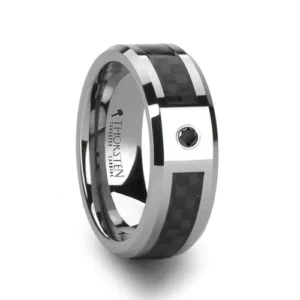 BENTLEY Tungsten Carbide Wedding Band with Black Carbon fiber and Black Diamond - 8mm Sporty and elegant are the words that come to mind when looking at this show stopping style from our tungsten wedding bandsline. This comfort fit wedding band has a flat style design with polished beveled edges. The ring is made from one piece of tungsten by cutting a channel almost all the way around the ring, leaving only the part with the 0.06 carat black diamond setting untouched. After, the beautiful black carbon fiber inlay is applied. Creating a high quality piece of work showcasing our designer skill. Universal Jewelry is proud to present the designer Tungsten Carbide Ring line by Thorsten. Tungsten Carbide is extremely scratch resistant and are a great choice for those who want jewelry to be both maintenance free and worry free. Re-sizing and Warranty on all Thorsten alternative metal rings, limited exchange|sizing fees compared to other retailers. Brand: Thorsten Metal Type: Tungsten Carbide Color: Black|Silver Finish: Polished Style: Beveled|Carbon Fiber Inlay|Diamonds Stones: Black Diamond SKU: W802-BCBD