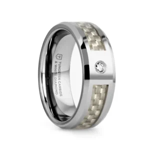 ROYCE Tungsten Carbide Wedding Band with White Carbon Fiber and White Diamond - 8mm Modern and luxurious this Tungsten Carbide wedding band design by Thorsten has a flat profile with polished beveled edges and is made by cutting a channel for the pure white Carbon Fiber inlay almost all the way around the ring, leaving only a setting area for a magnificent 0.06 carat White Diamond. Engraving available! See Pictures for Details. Does Not Delay Order. Includes Thorsten Lifetime and Lifetime Sizing Warranty (excluding re-engraving). Available in an 8mm width. Tungsten Carbide is the newest and strongest metal for jewelry that does not scratch easily. Comfort Fit – domed interior band slides over the knuckle easier with less friction. Brand: Thorsten Metal Type: Tungsten Carbide Color: Silver|White Finish: Polished Style: Beveled|Carbon Fiber Inlay|Diamonds Stones: Natural Diamond SKU: W803-WCWD
