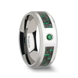 ASPEN Tungsten Carbide Ring with Black and Green Carbon Fiber and Green Emerald - 8mm A black and green Carbon Fiber inlay is the perfect complement to the elegant 2.5mm wide round cut Green Emerald that adorns this exquisite Tungsten Carbide wedding band by Thorsten. Engraving available! See Pictures for Details. Does Not Delay Order. Includes Thorsten Lifetime and Lifetime Sizing Warranty (excluding re-engraving). Available in an 8mm width. Tungsten Carbide—the newest and strongest metal for jewelry that does not scratch easily. Note that the inlay can be scratched. Comfort Fit – domed interior band slides over the knuckle easier with less friction. Brand: Thorsten Metal Type: Tungsten Carbide Color: Black|Green|Silver Finish: Polished Style: Beveled|Carbon Fiber Inlay|Flat|Gemstones Stones: None SKU: W866-TEBG