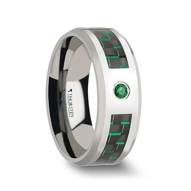 ASPEN Tungsten Carbide Ring with Black and Green Carbon Fiber and Green Emerald - 8mm A black and green Carbon Fiber inlay is the perfect complement to the elegant 2.5mm wide round cut Green Emerald that adorns this exquisite Tungsten Carbide wedding band by Thorsten. Engraving available! See Pictures for Details. Does Not Delay Order. Includes Thorsten Lifetime and Lifetime Sizing Warranty (excluding re-engraving). Available in an 8mm width. Tungsten Carbide—the newest and strongest metal for jewelry that does not scratch easily. Note that the inlay can be scratched. Comfort Fit – domed interior band slides over the knuckle easier with less friction. Brand: Thorsten Metal Type: Tungsten Carbide Color: Black|Green|Silver Finish: Polished Style: Beveled|Carbon Fiber Inlay|Flat|Gemstones Stones: None SKU: W866-TEBG